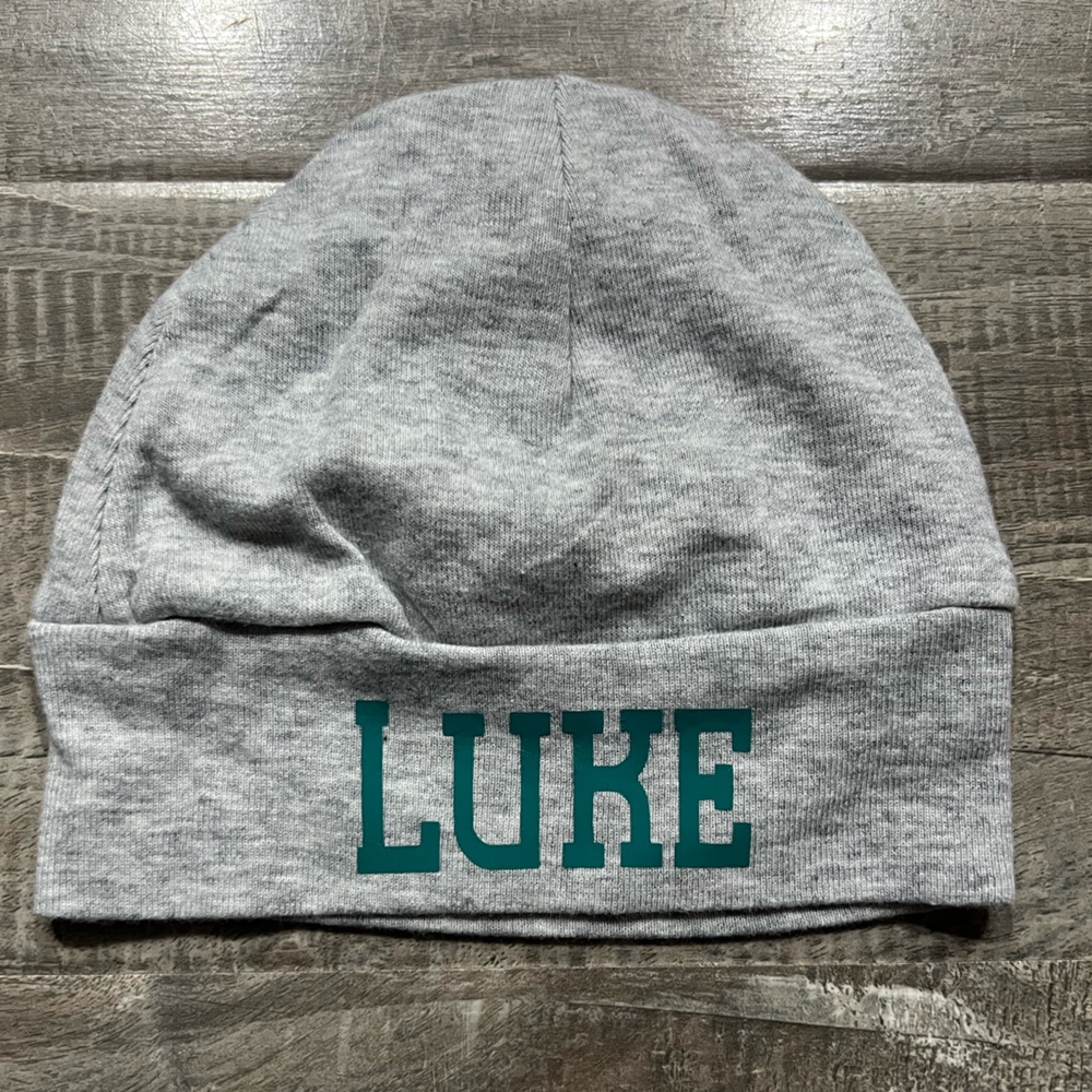 Gray baby hat with Green Text